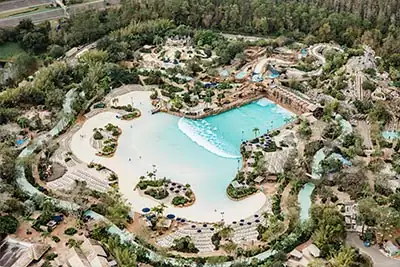 Aerial helicopter view of Disney Springs, Typhoon Lagoon, and nearby resorts in Kissimmee, Florida during a scenic sightseeing tour Aerial helicopter view of Disney Springs, Typhoon Lagoon, and nearby resorts in Kissimmee, Florida during a scenic sightseeing tour
