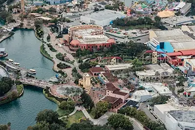 Panoramic helicopter view of Universal Orlando, Hogwarts Castle, Volcano Bay, ICON Park, and Disney attractions Panoramic helicopter view of Universal Orlando, Hogwarts Castle, Volcano Bay, ICON Park, and Disney attractions